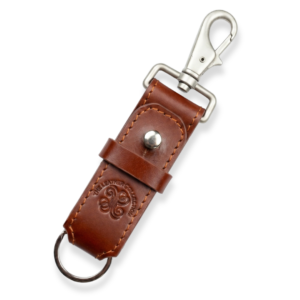 A brown leather key fob with visible stitching.