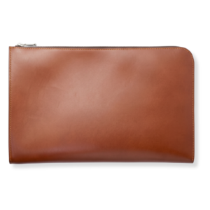 A sleek brown bridle leather legal folio with a silver zipper