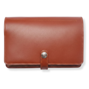 A brown leather multi currency travel journal with smooth texture and neat stitching.
