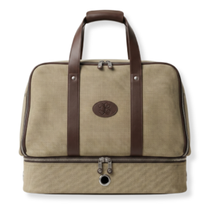 Tan canvas and brown leather club bag by The Leather Collection, featuring dual handles, an embossed logo, and a zippered bottom shoe compartment.