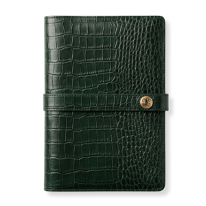 Large dark green crocodile-embossed leather notebook cover featuring a strap closure with a branded logo button by The Leather Collection.